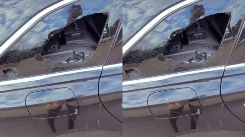 La vitre de la voiture d'Apoutchou National caillassée